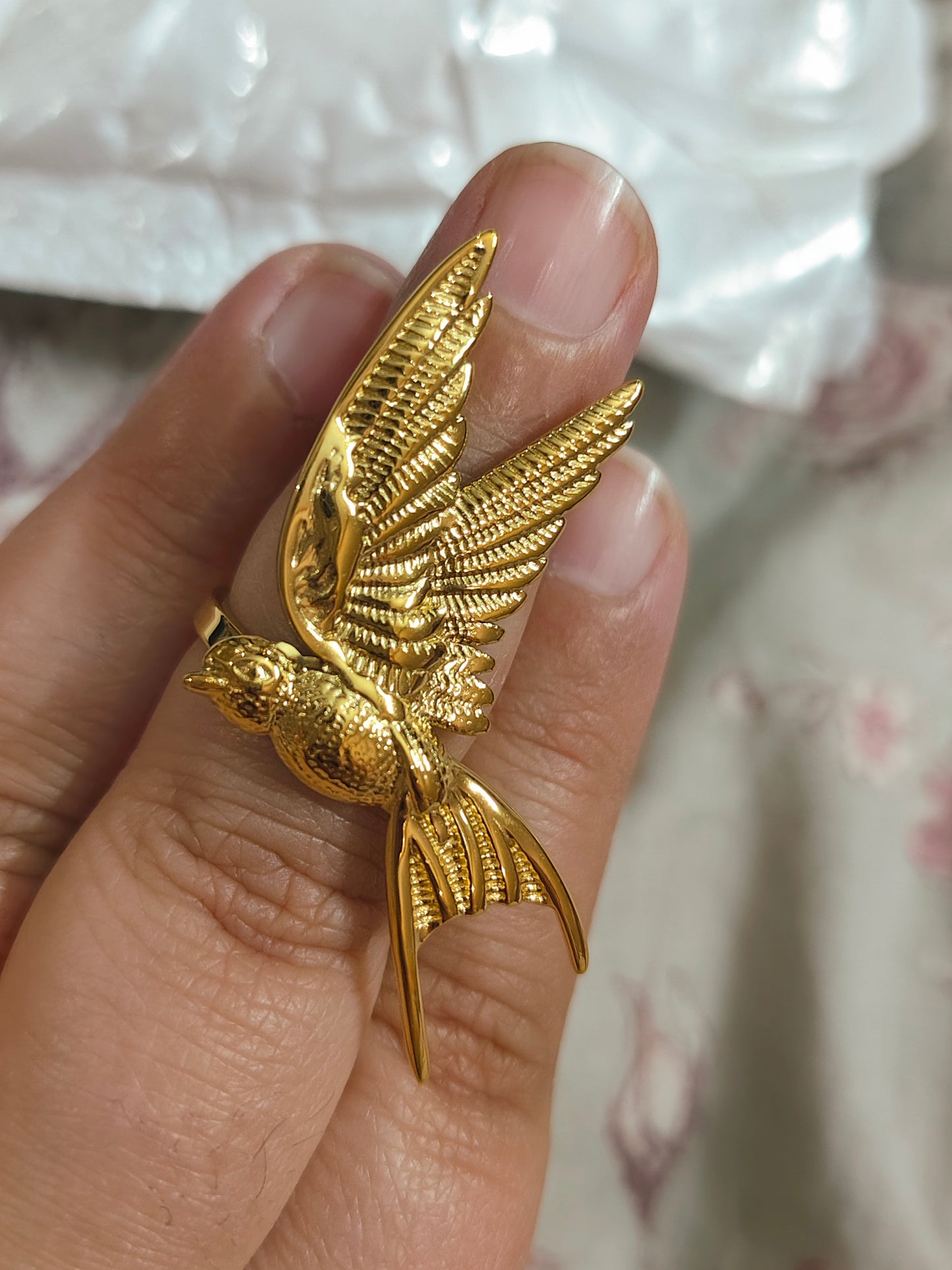 Golden bird ring